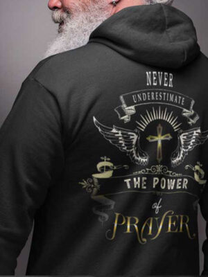 black hoodie with text never underestimate the power of prayer and a cross with wings